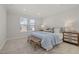 Serene main bedroom featuring a comfortable bed, soft lighting, and neutral decor at 2317 Forsythia Trl, Fuquay Varina, NC 27526