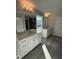 Modern bathroom featuring dual vanities, tile floors, and large mirrors at 2391 Englemann Dr Dr # 124, Apex, NC 27502