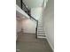 A grand foyer with soaring ceilings, elegant staircase and sleek, grey wood-look flooring at 2391 Englemann Dr Dr # 124, Apex, NC 27502