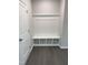 Well-appointed mudroom with custom built-in storage and convenient bench seating at 2391 Englemann Dr Dr # 124, Apex, NC 27502