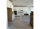New kitchen with white cabinets, an island, and tile backsplash at 2476 Field Poppy Dr # 171, Apex, NC 27502