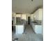 New kitchen featuring white cabinets, an island, and tile backsplash at 2476 Field Poppy Dr # 171, Apex, NC 27502