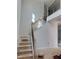 New home staircase featuring wood handrail with black iron spindles at 2476 Field Poppy Dr # 171, Apex, NC 27502