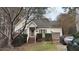 Tan house with a brown garage door and small front yard at 2633 Farlow Gap Ln, Raleigh, NC 27603