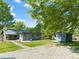 Exterior view of the house with beautiful landscaping and a nice backyard shed at 320 W Orange St, Hillsborough, NC 27278