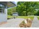 Exterior view of the house with backyard seating, landscaping, and a shed at 320 W Orange St, Hillsborough, NC 27278