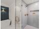 Modern bathroom with a glass shower, soaking tub, and stylish blue subway tile at 320 W Orange St, Hillsborough, NC 27278