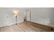 Bedroom featuring neutral walls, three doors, and beautiful hardwood floors at 320 W Orange St, Hillsborough, NC 27278