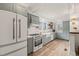 Renovated kitchen boasts modern appliances and light-grey cabinets at 320 W Orange St, Hillsborough, NC 27278