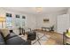 Welcoming living room with natural light, trendy decor, and an open layout, perfect for entertaining at 320 W Orange St, Hillsborough, NC 27278
