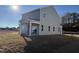 Spacious backyard with a covered patio, perfect for outdoor entertaining and relaxation at 346 Tormore, Homesite 125, Sanford, NC 27330