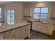 Modern kitchen with granite countertops, stainless steel appliances, and ample cabinet space at 346 Tormore, Homesite 125, Sanford, NC 27330