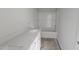 Bathroom featuring a new vanity and a shower with new tub at 3936 Well Fleet Drive, Fuquay Varina, NC 27526