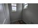 Powder room under construction features two windows and grey walls at 3936 Well Fleet Drive, Fuquay Varina, NC 27526