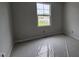 Bright bedroom featuring a large window offering ample natural light at 3936 Well Fleet Drive, Fuquay Varina, NC 27526