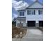 Charming new construction two-story home featuring a two-car garage and stone accents at 3936 Well Fleet Drive, Fuquay Varina, NC 27526