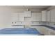 New kitchen features white cabinets and a center island at 3936 Well Fleet Drive, Fuquay Varina, NC 27526