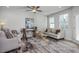 Spacious living room boasts a sofa, armchairs, and ample natural light at 3936 Well Fleet Drive, Willow Springs, NC 27592