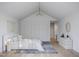 Serene bedroom with neutral tones, vaulted ceiling, and elegant lighting at 5001 Rampart St, Raleigh, NC 27609