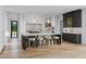 Modern kitchen boasts a large island with seating, sleek countertops, and stylish cabinetry at 5001 Rampart St, Raleigh, NC 27609