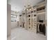 Spacious walk-in closet with custom shelving, ample storage, and stylish lighting at 5001 Rampart St, Raleigh, NC 27609