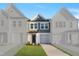 Charming two-story home with gray siding, white trim, and a well-manicured lawn at 520 Eversden Dr, Zebulon, NC 27597