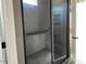 Modern bathroom featuring a glass-enclosed shower with built-in shelving at 71 Slocum Dr, Wendell, NC 27591