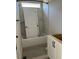 Modern bathroom features a bathtub with tiled walls and a white vanity with black hardware at 71 Slocum Dr, Wendell, NC 27591
