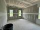 Spacious bedroom boasting large windows, providing natural light and unfinished walls ready for your vision at 71 Slocum Dr, Wendell, NC 27591
