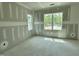 Bright bedroom showcasing large windows and unfinished walls ready for your vision at 71 Slocum Dr, Wendell, NC 27591