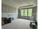 Bright, unfinished bedroom with drywall and natural light from three windows; a blank canvas for design at 71 Slocum Dr, Wendell, NC 27591