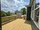 Wood deck offering scenic views of the surrounding neighborhood and verdant landscape at 71 Slocum Dr, Wendell, NC 27591