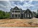 New construction home with a two-story facade, showcasing balcony, landscaping, and modern design at 71 Slocum Dr, Wendell, NC 27591