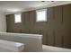 Hallway featuring wainscotting and small windows at 71 Slocum Dr, Wendell, NC 27591