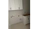 The laundry room is equipped with modern white cabinets and ample storage solutions at 71 Slocum Dr, Wendell, NC 27591