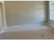 Bright living room with neutral paint, white trim, and large window, offering a blank canvas for personalization at 71 Slocum Dr, Wendell, NC 27591