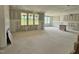 Unfinished living room with lots of natural light, large open floorplan with bare walls ready for customization at 71 Slocum Dr, Wendell, NC 27591