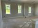 Sunlit living room with classic windows and exterior door at 71 Slocum Dr, Wendell, NC 27591