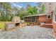 Backyard patio with a stone outdoor kitchen and bar area for entertaining at 129 Jeffress Dr, Louisburg, NC 27549