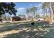 House with a large backyard, deck, and detached shed at 129 Jeffress Dr, Louisburg, NC 27549