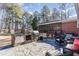 Relaxing backyard with patio, grill, and screened porch at 129 Jeffress Dr, Louisburg, NC 27549