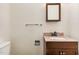 Cozy bathroom with granite countertop, wooden cabinets, and classic design at 129 Jeffress Dr, Louisburg, NC 27549