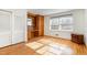 Bedroom with hardwood floors, built-in storage and desk space, plus bright natural lighting at 129 Jeffress Dr, Louisburg, NC 27549