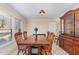 Traditional dining room featuring a classic wooden table set and a vintage china cabinet at 129 Jeffress Dr, Louisburg, NC 27549