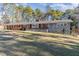 Ranch-style home with brick and stone exterior at 129 Jeffress Dr, Louisburg, NC 27549