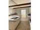 Well-lit kitchen with stainless appliances, granite counters, and tile floors at 129 Jeffress Dr, Louisburg, NC 27549