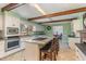 Open kitchen with a spacious island, barstool seating, and integrated appliances for modern convenience at 129 Jeffress Dr, Louisburg, NC 27549