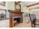 Elegant kitchen showcasing a rustic fireplace and built-in storage, perfect for culinary enthusiasts at 129 Jeffress Dr, Louisburg, NC 27549