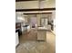 Bright kitchen with granite counters, stainless appliances, and a breakfast bar at 129 Jeffress Dr, Louisburg, NC 27549