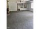 Spacious living room with a stone fireplace as a focal point and large window at 129 Jeffress Dr, Louisburg, NC 27549